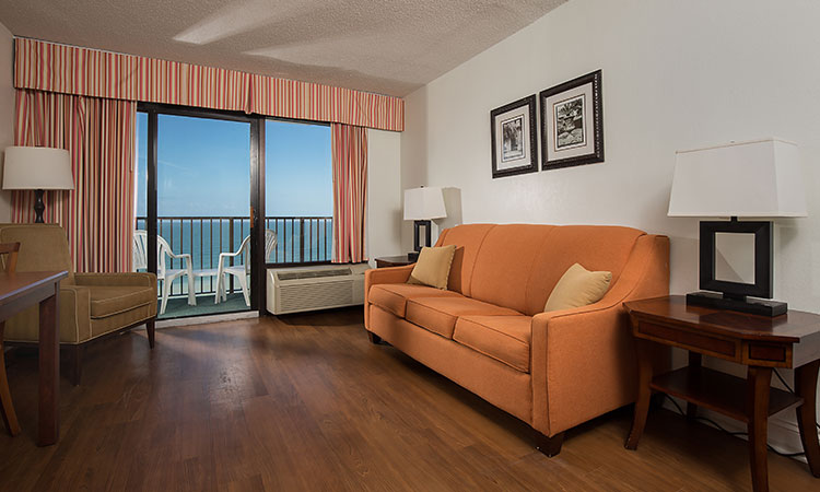 Features 2 queen beds, 1 bathroom, complete kitchen, spacious sitting area, private balcony, and oceanfront view.