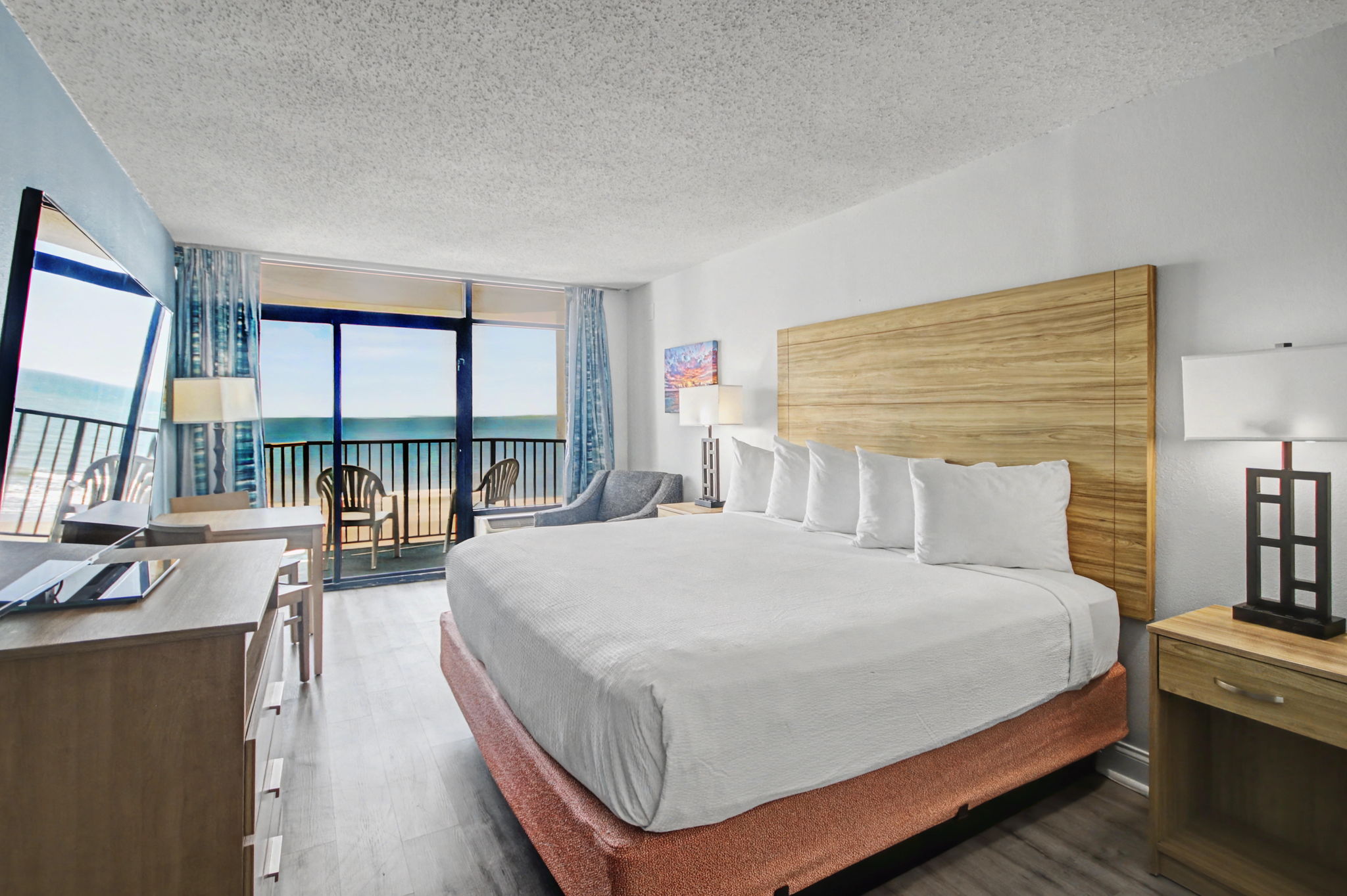Features 1 king bed, 1 bathroom, complete kitchen, private balcony, and oceanfront view.
